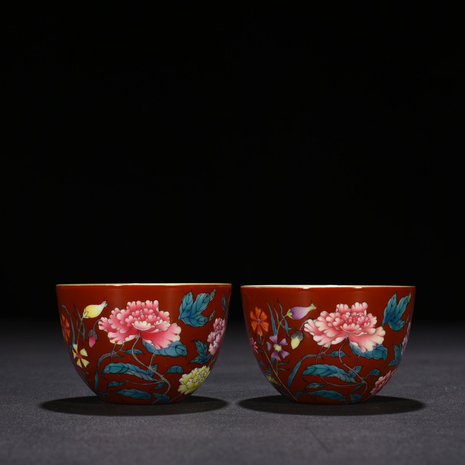Qing Dynasty Yongzheng red ground pastel peony flower pattern lying foot cup vat cup