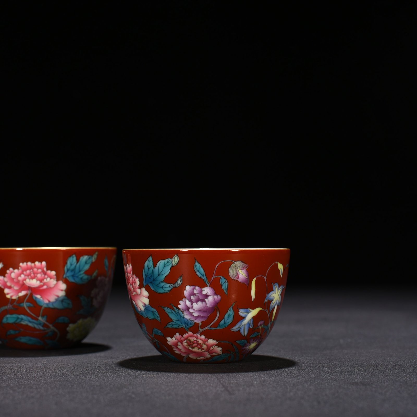 Qing Dynasty Yongzheng red ground pastel peony flower pattern lying foot cup vat cup