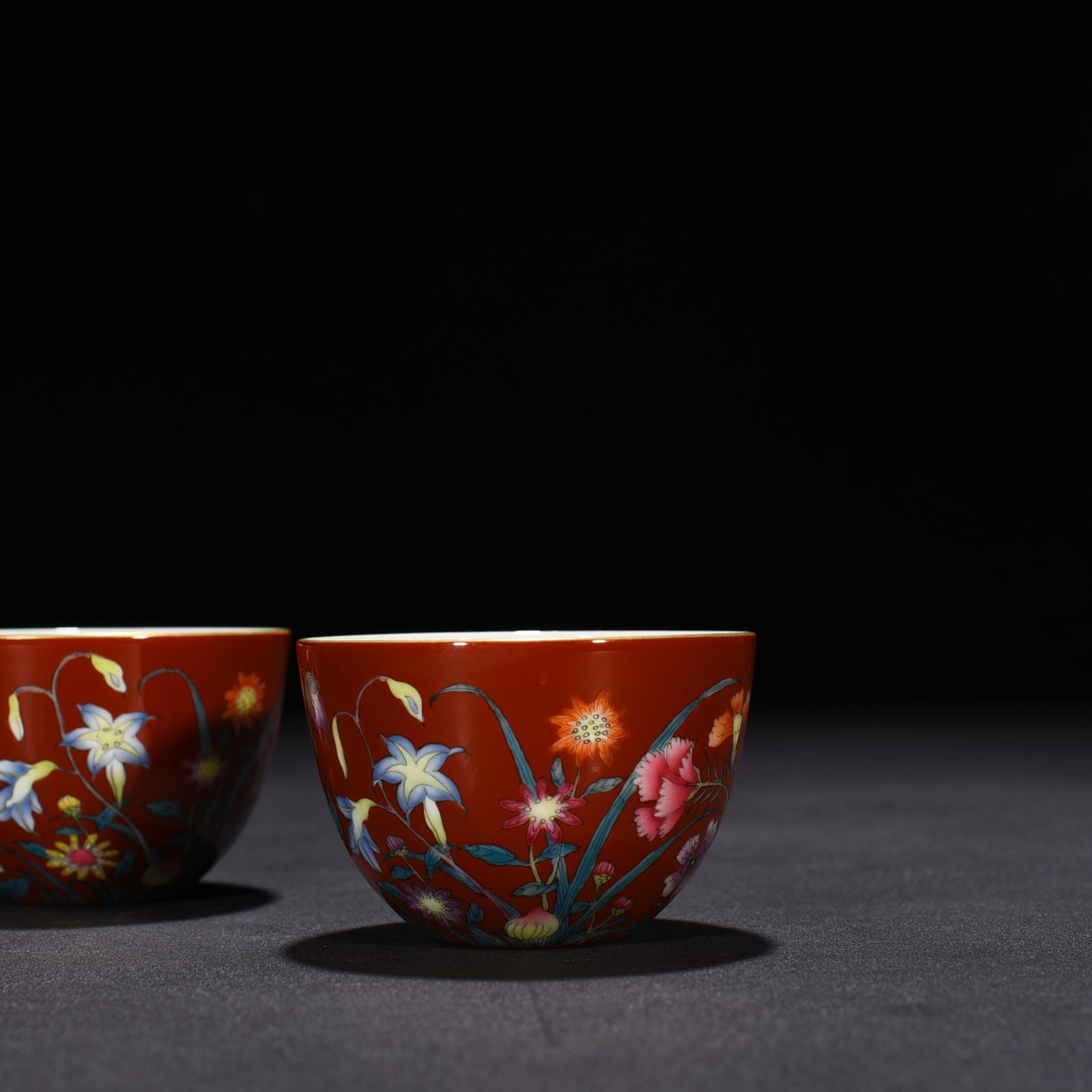 Qing Dynasty Yongzheng red ground pastel peony flower pattern lying foot cup vat cup