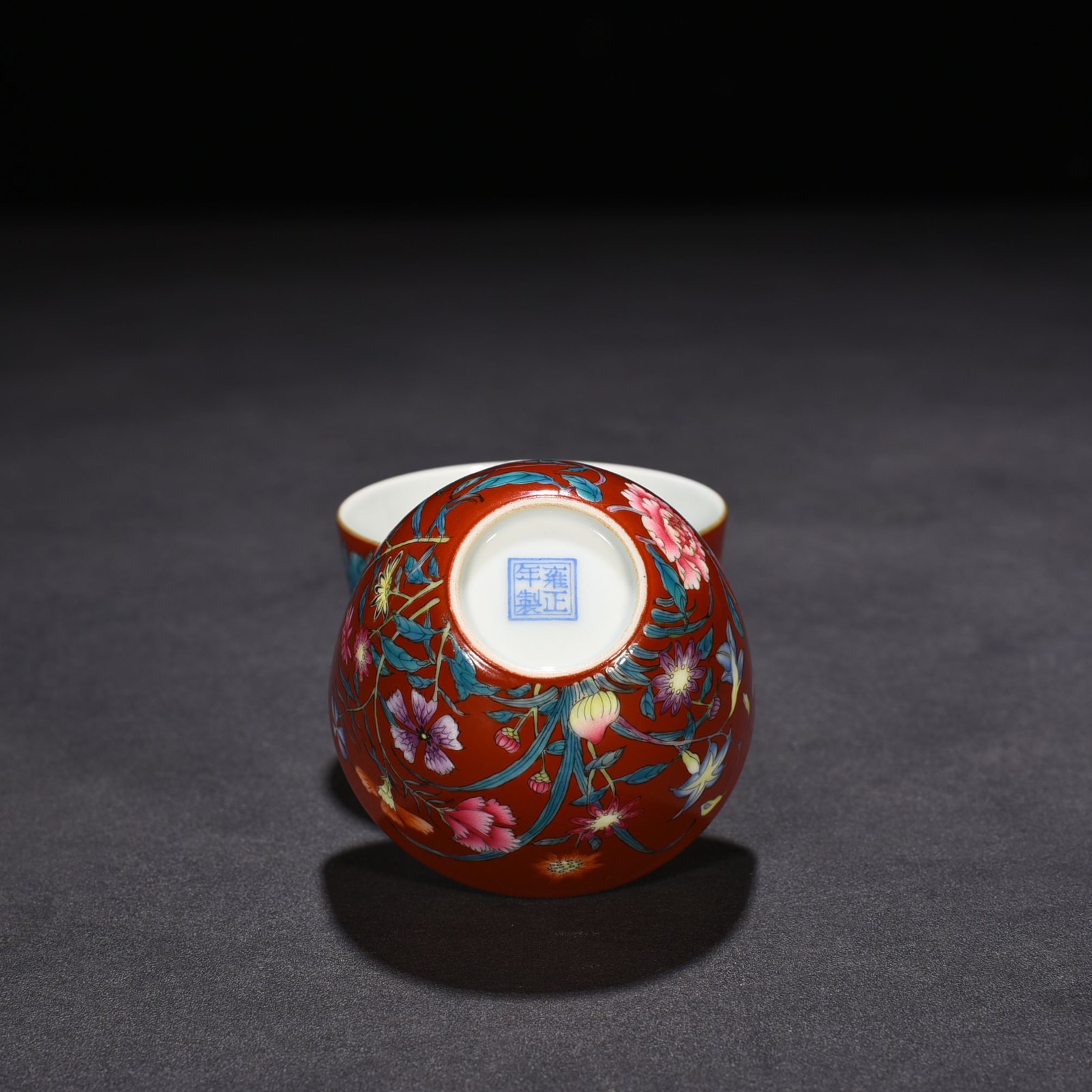Qing Dynasty Yongzheng red ground pastel peony flower pattern lying foot cup vat cup