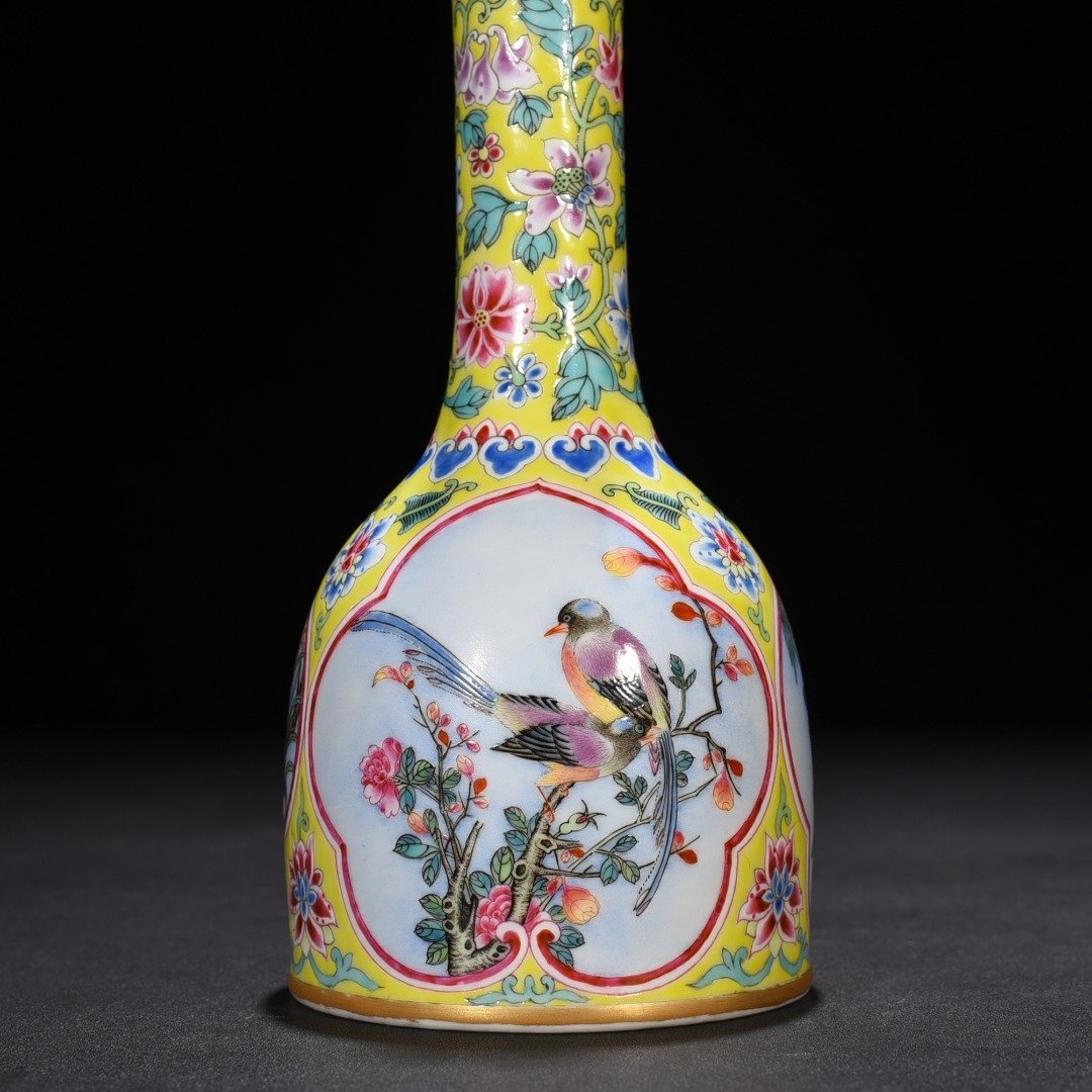 Qing Dynasty Yongzheng yellow ground windowed enamel rattle with flower