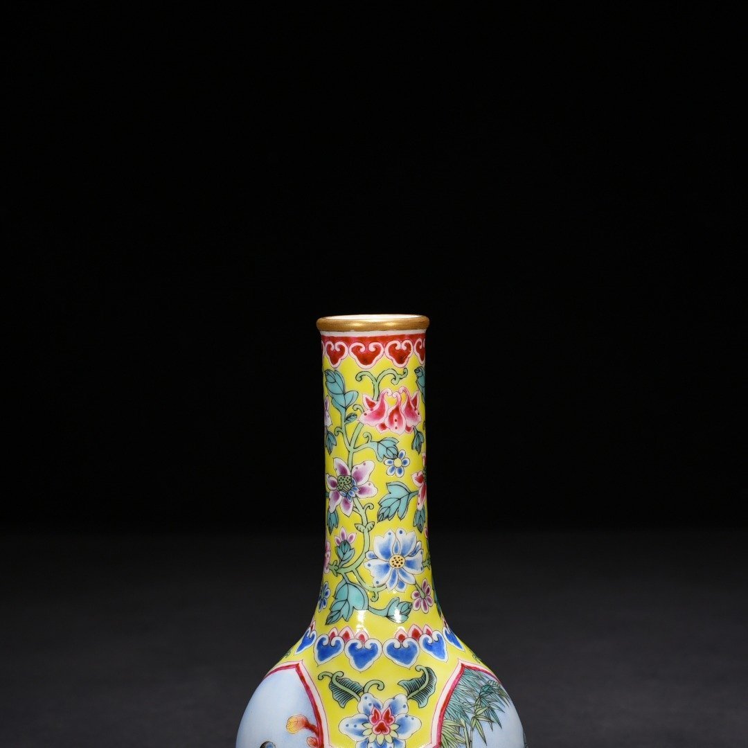 Qing Dynasty Yongzheng yellow ground windowed enamel rattle with flower