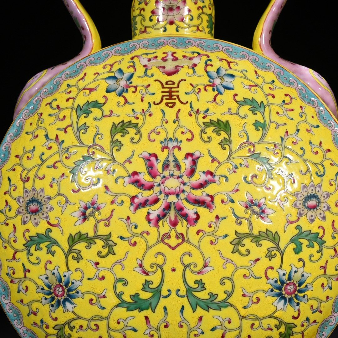 Qing Dynasty Yongzheng yellow ground pastel lucky and longevity flower pattern Ruyi ear flat vase