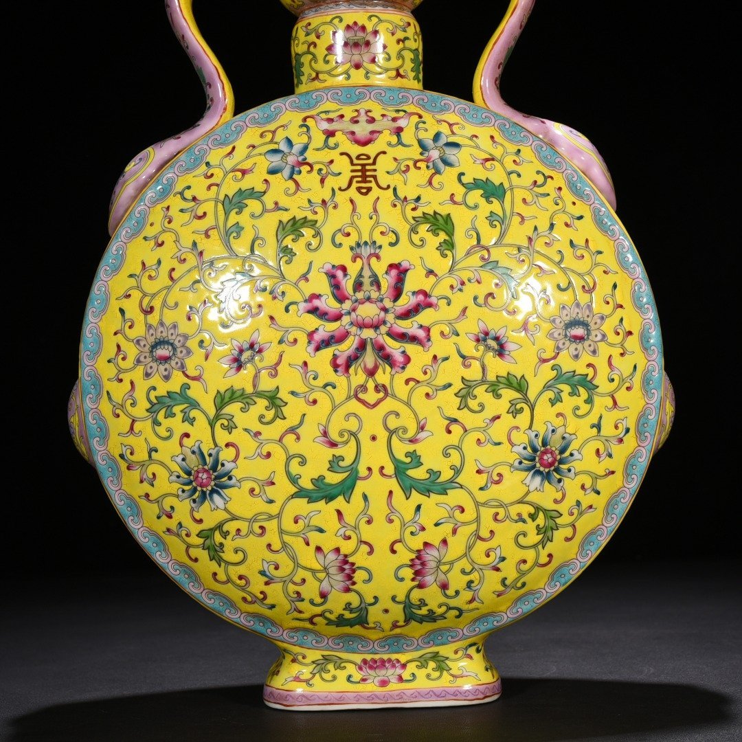 Qing Dynasty Yongzheng yellow ground pastel lucky and longevity flower pattern Ruyi ear flat vase