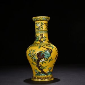 Qing Dynasty Yongzheng yellow ground three-color five-blessing and nine-peach bottle
