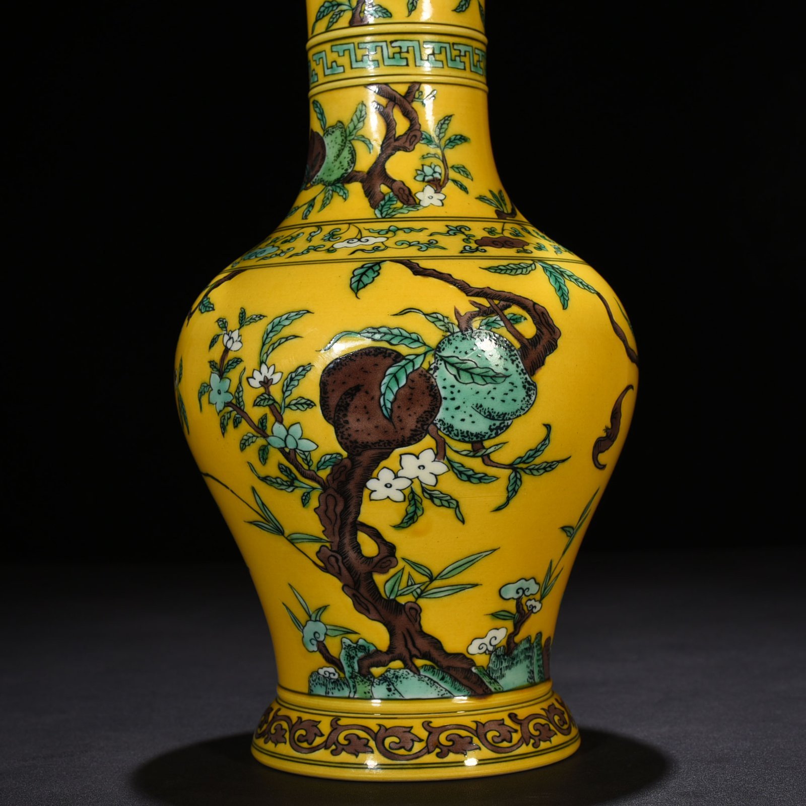 Qing Dynasty Yongzheng yellow ground three-color five-blessing and nine-peach bottle