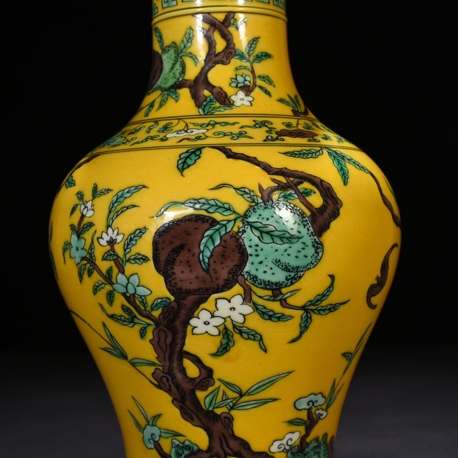 Qing Dynasty Yongzheng yellow ground three-color five-blessing and nine-peach bottle