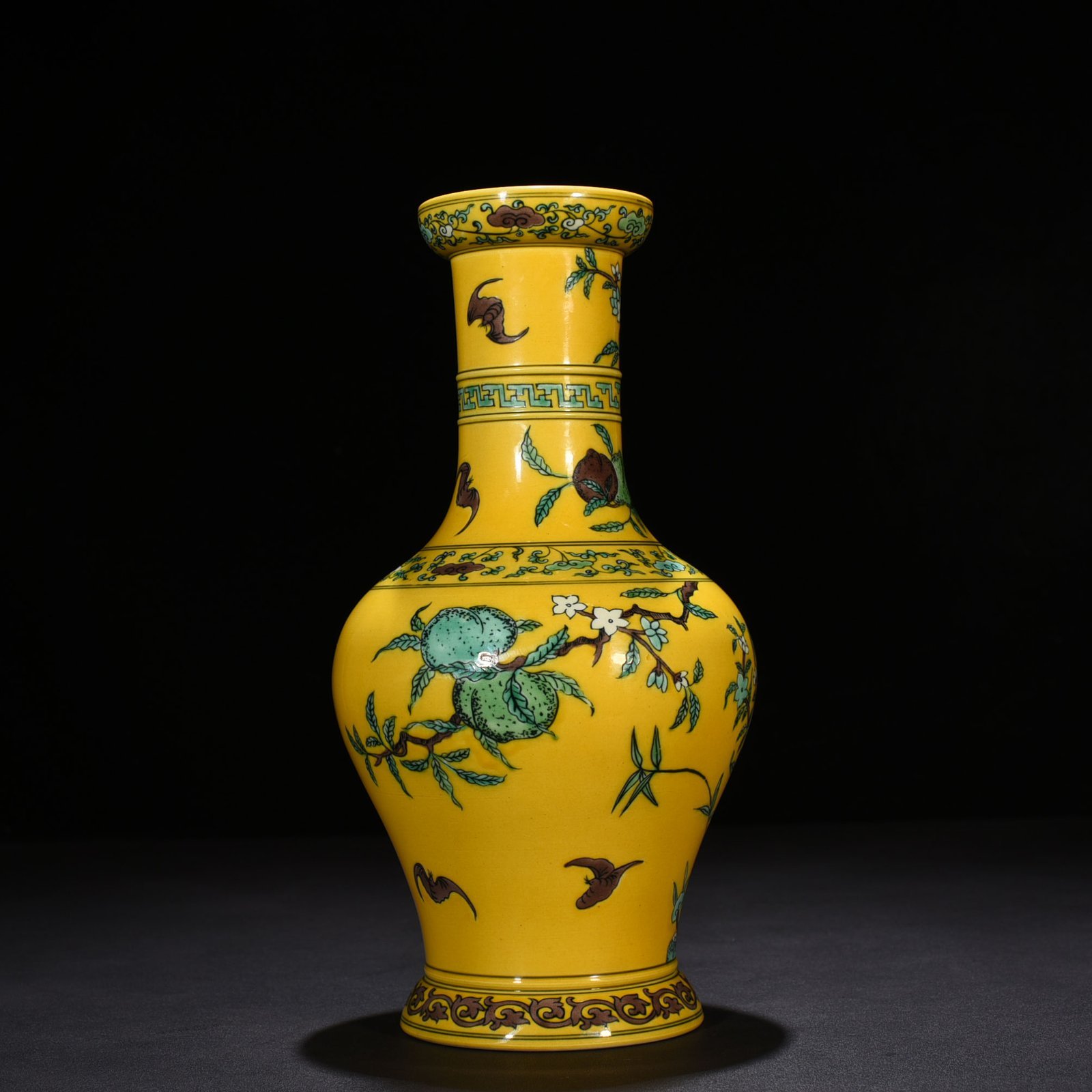 Qing Dynasty Yongzheng yellow ground three-color five-blessing and nine-peach bottle
