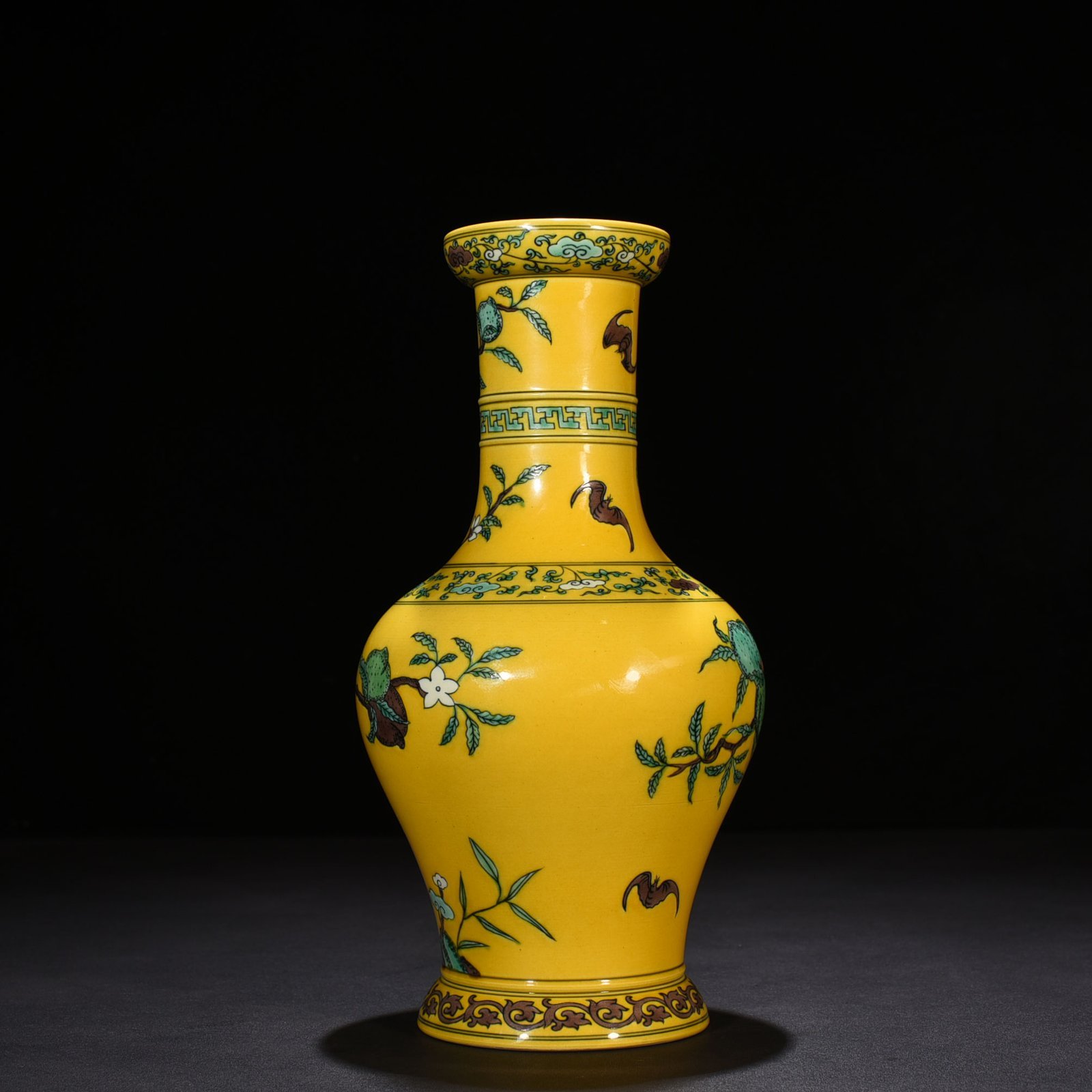 Qing Dynasty Yongzheng yellow ground three-color five-blessing and nine-peach bottle