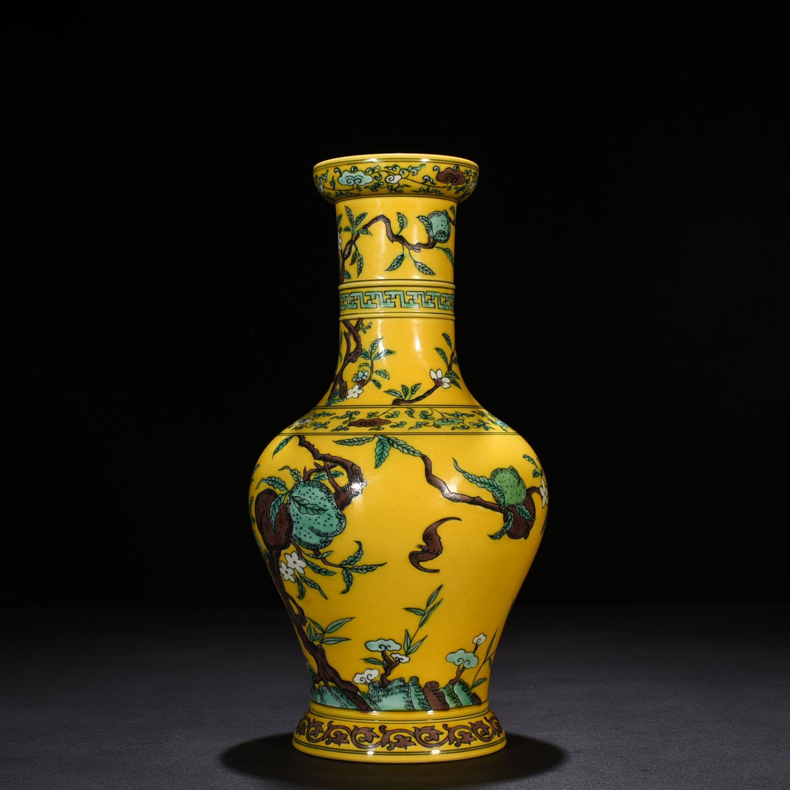 Qing Dynasty Yongzheng yellow ground three-color five-blessing and nine-peach bottle