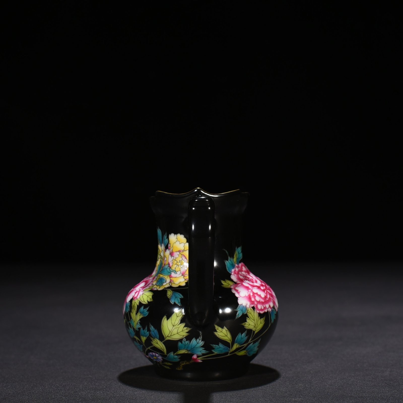 Qing Dynasty Yongzheng black ground enamel peony pattern monk’s hat tea dispenser
