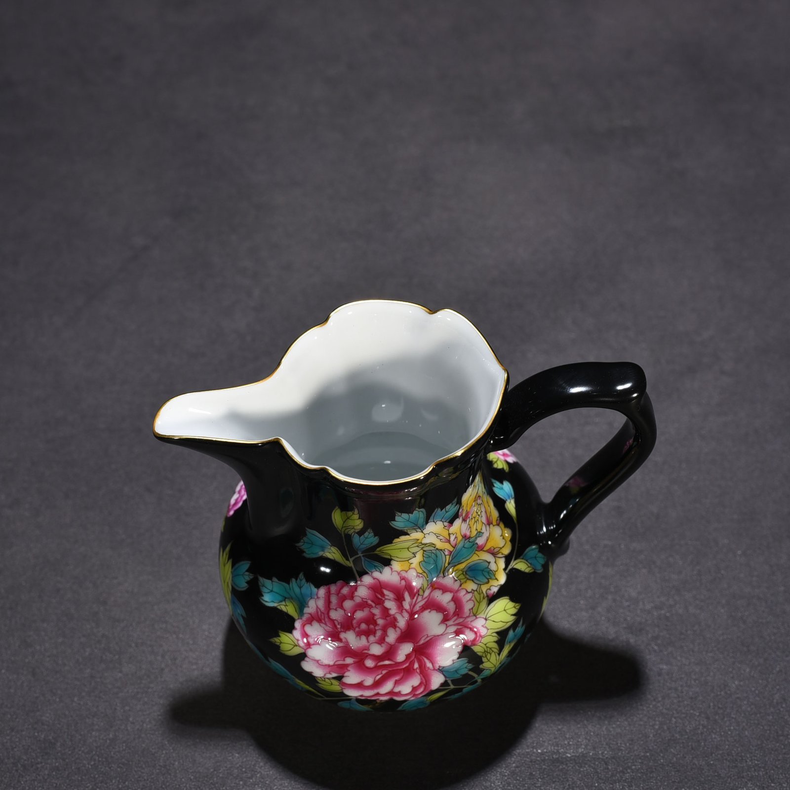 Qing Dynasty Yongzheng black ground enamel peony pattern monk’s hat tea dispenser