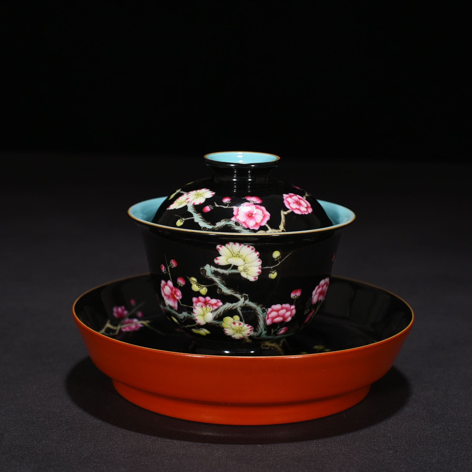 Qing Dynasty Yongzheng black ground pastel plum blossom pattern covered bowl