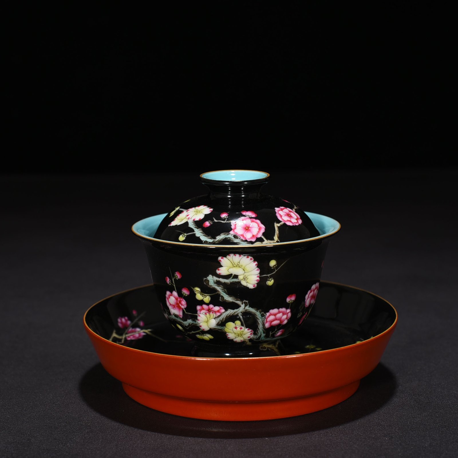 Qing Dynasty Yongzheng black ground pastel plum blossom pattern covered bowl