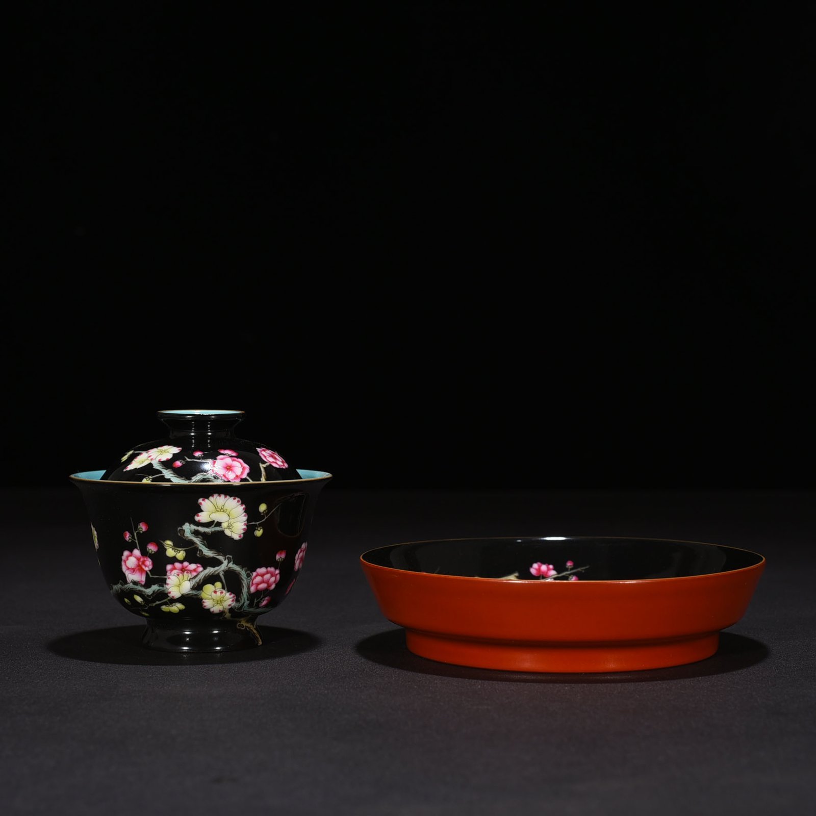 Qing Dynasty Yongzheng black ground pastel plum blossom pattern covered bowl