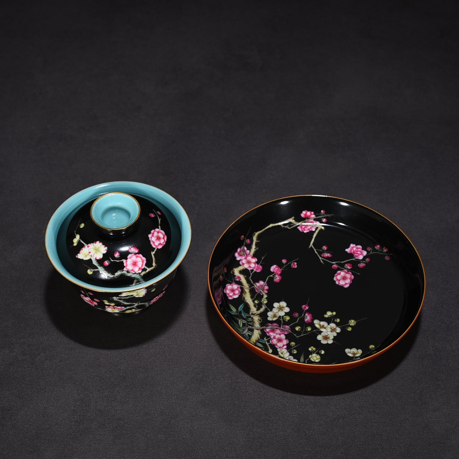 Qing Dynasty Yongzheng black ground pastel plum blossom pattern covered bowl