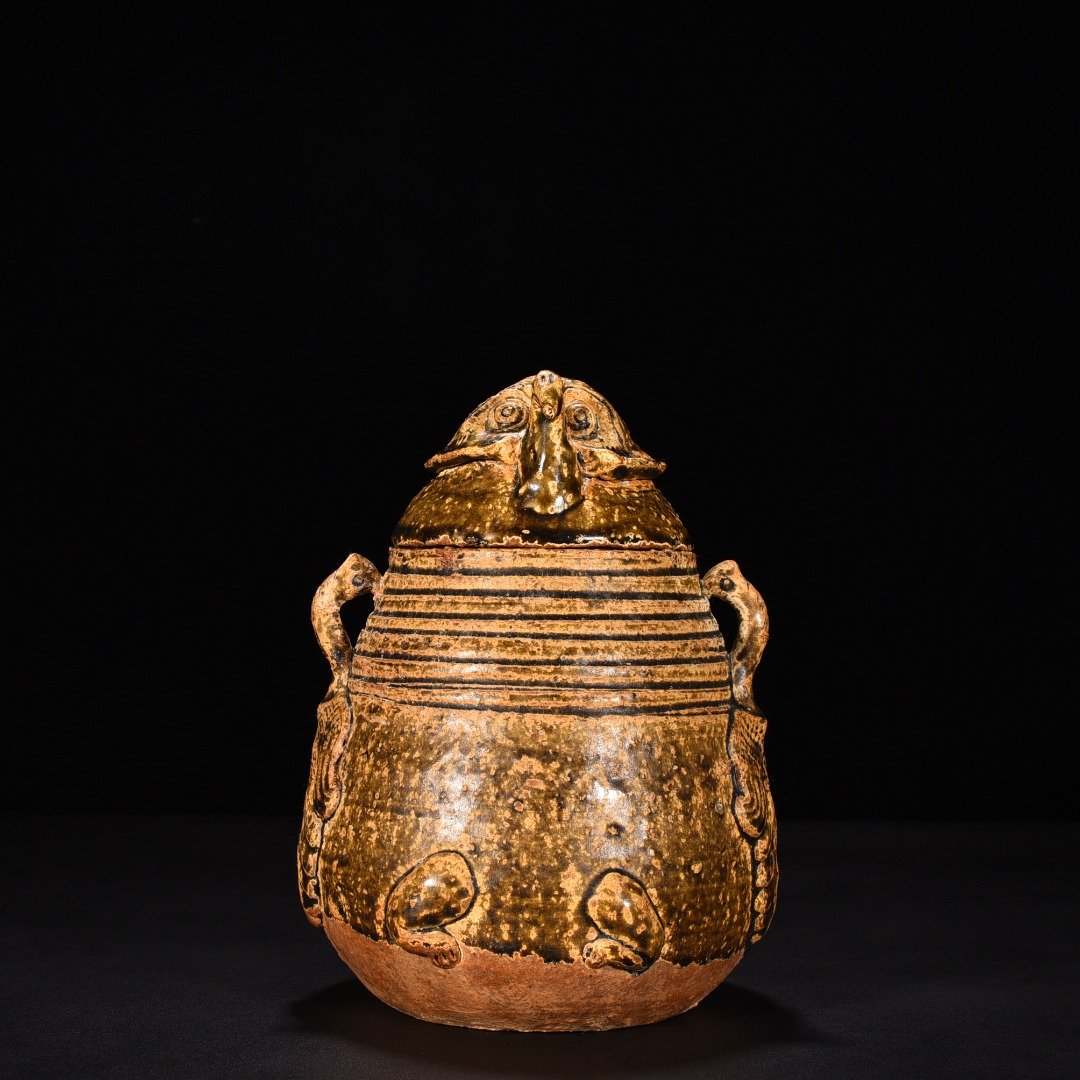 Jin Dynasty Yue kiln celadon animal faces and ears vase