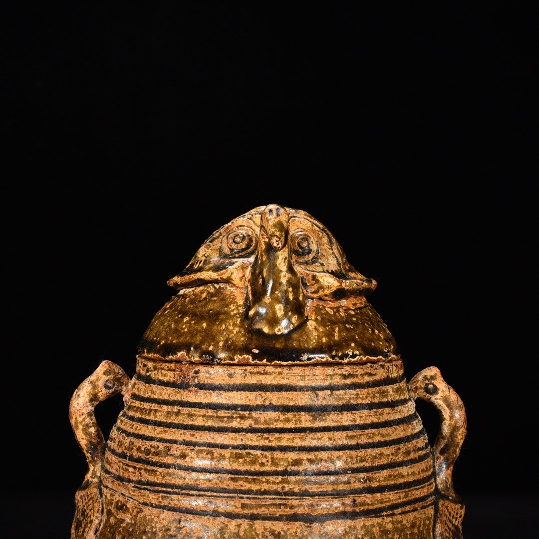 Jin Dynasty Yue kiln celadon animal faces and ears vase