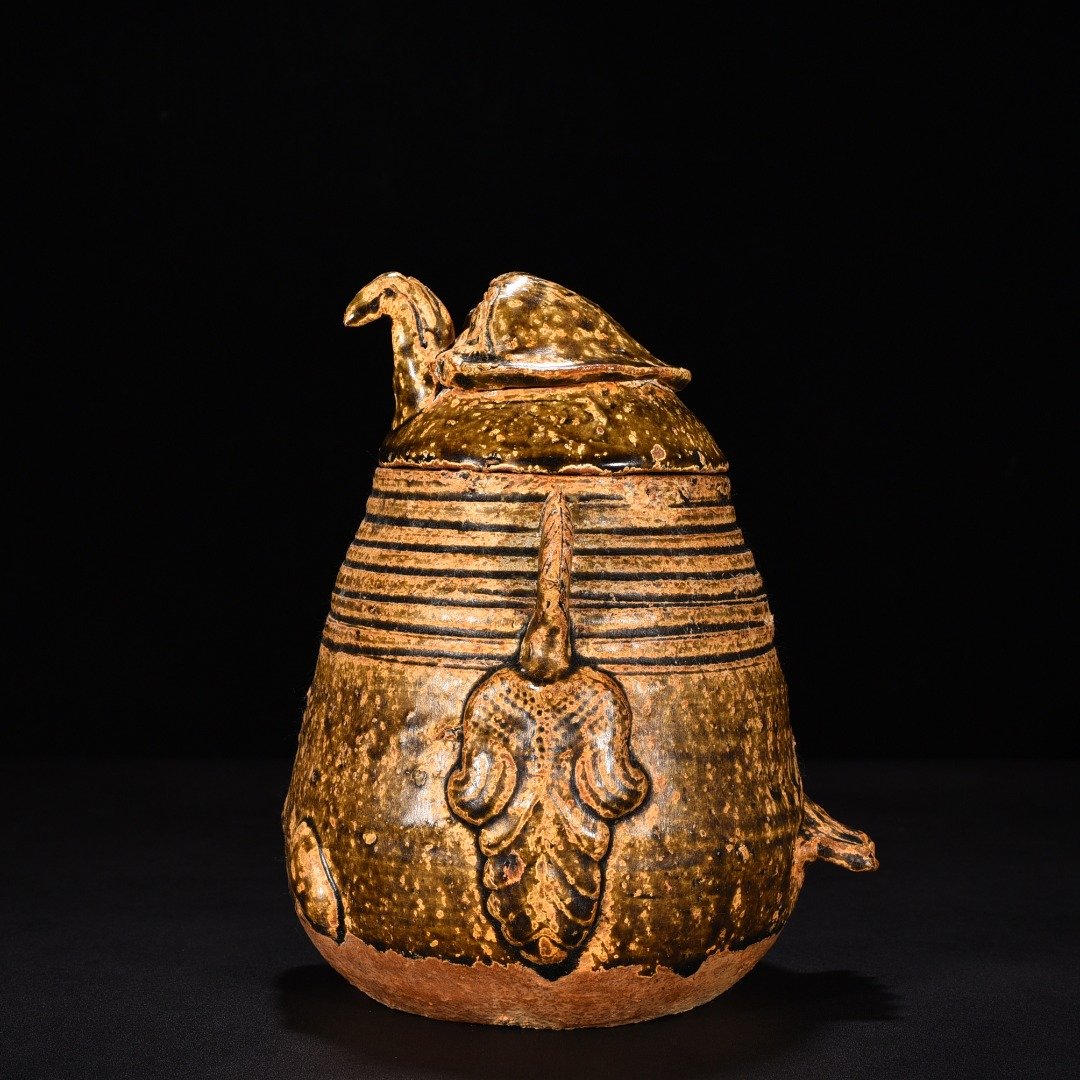 Jin Dynasty Yue kiln celadon animal faces and ears vase