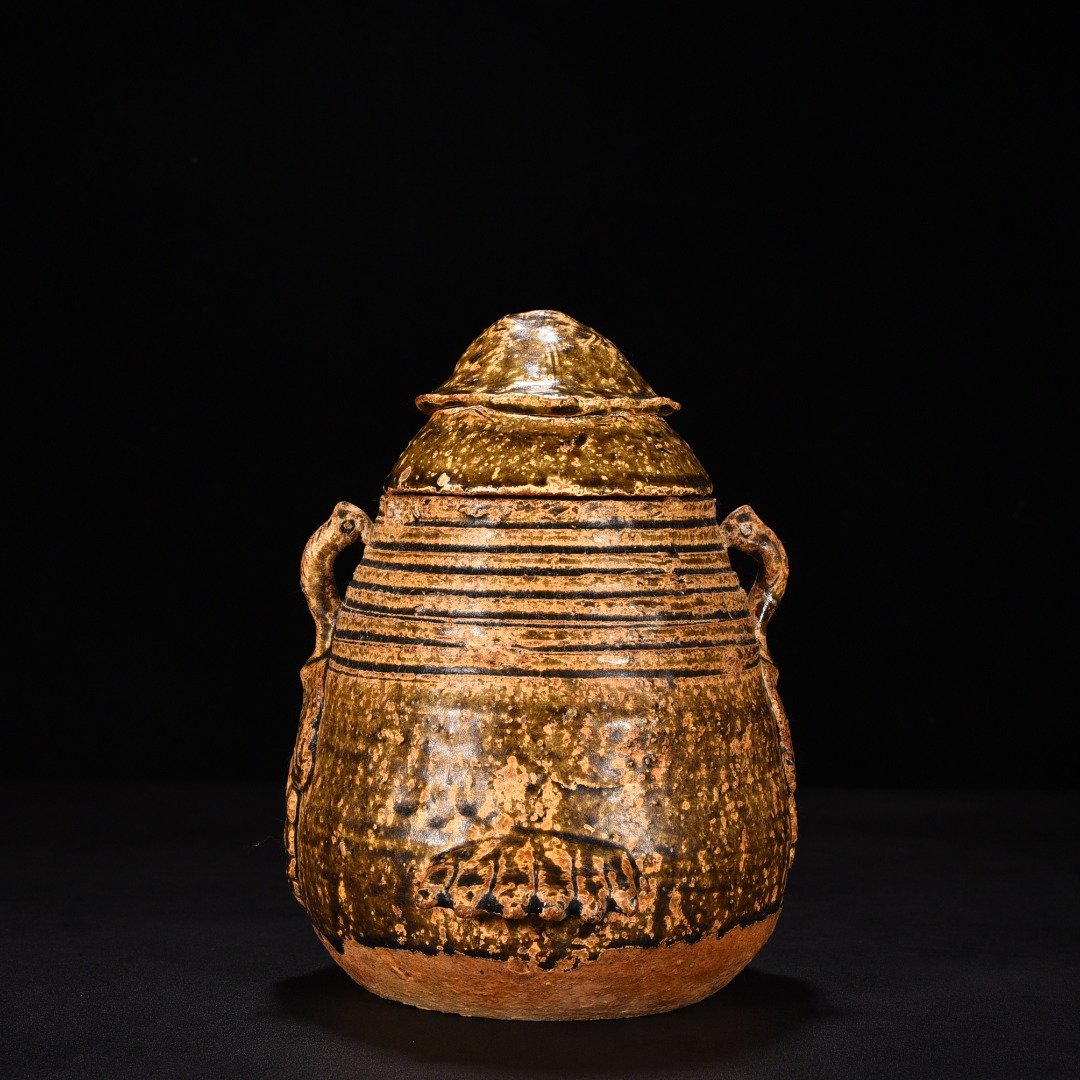 Jin Dynasty Yue kiln celadon animal faces and ears vase