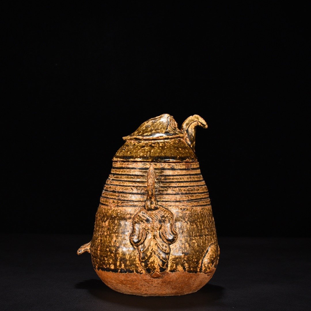 Jin Dynasty Yue kiln celadon animal faces and ears vase