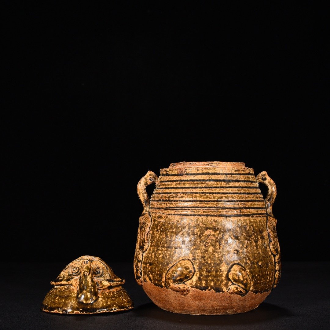 Jin Dynasty Yue kiln celadon animal faces and ears vase