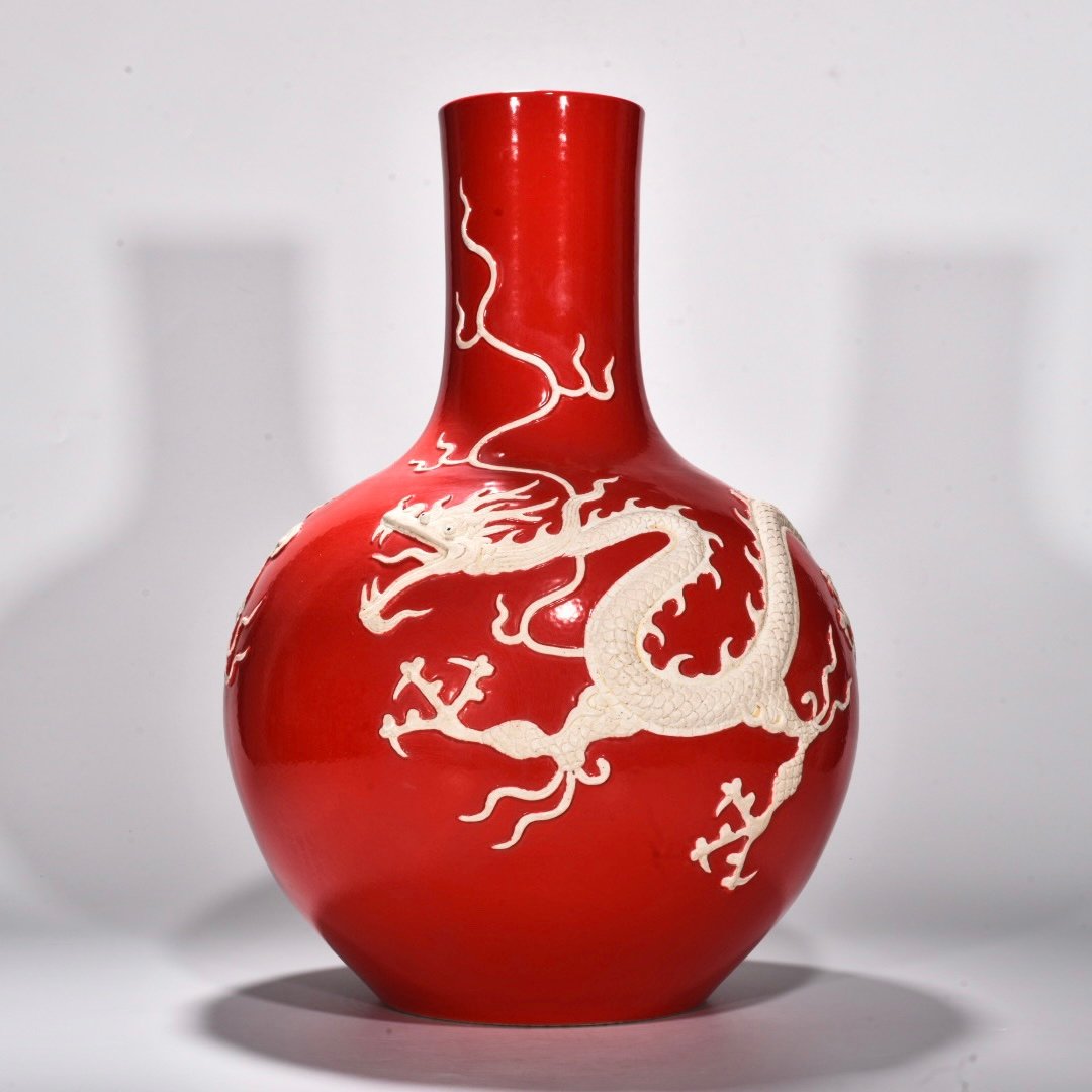 Yuan Dynasty Red glazed celestial sphere vase with cloud and dragon patterns carved