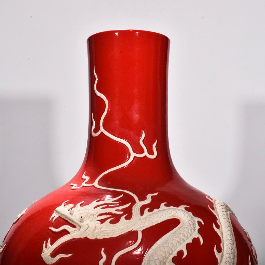 Yuan Dynasty Red glazed celestial sphere vase with cloud and dragon patterns carved