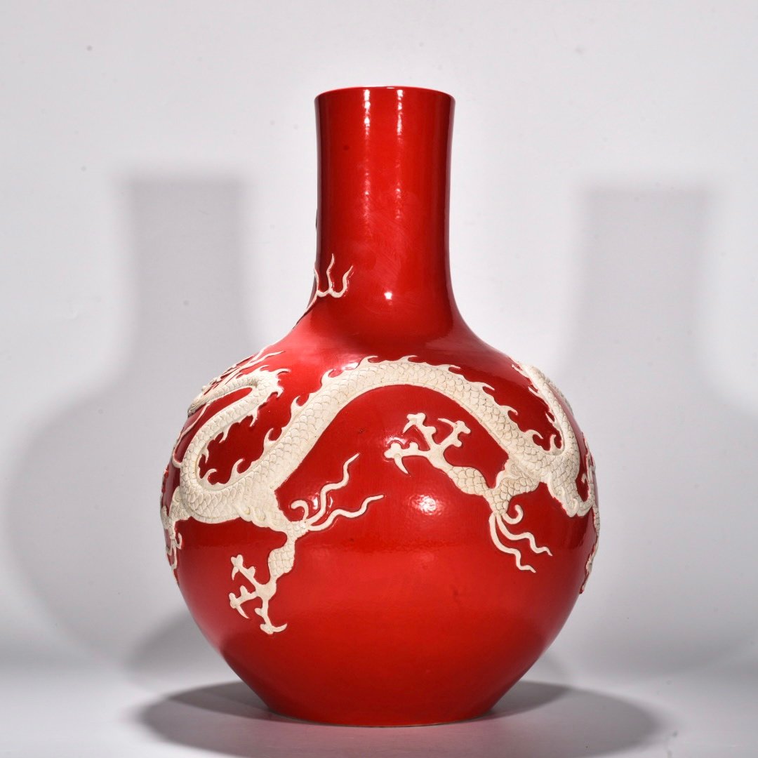 Yuan Dynasty Red glazed celestial sphere vase with cloud and dragon patterns carved