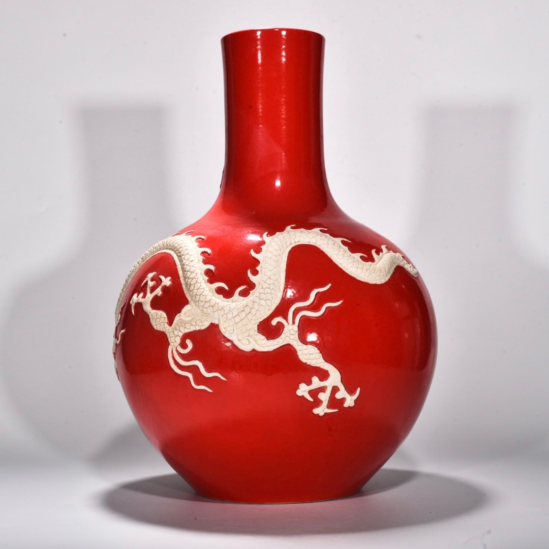 Yuan Dynasty Red glazed celestial sphere vase with cloud and dragon patterns carved