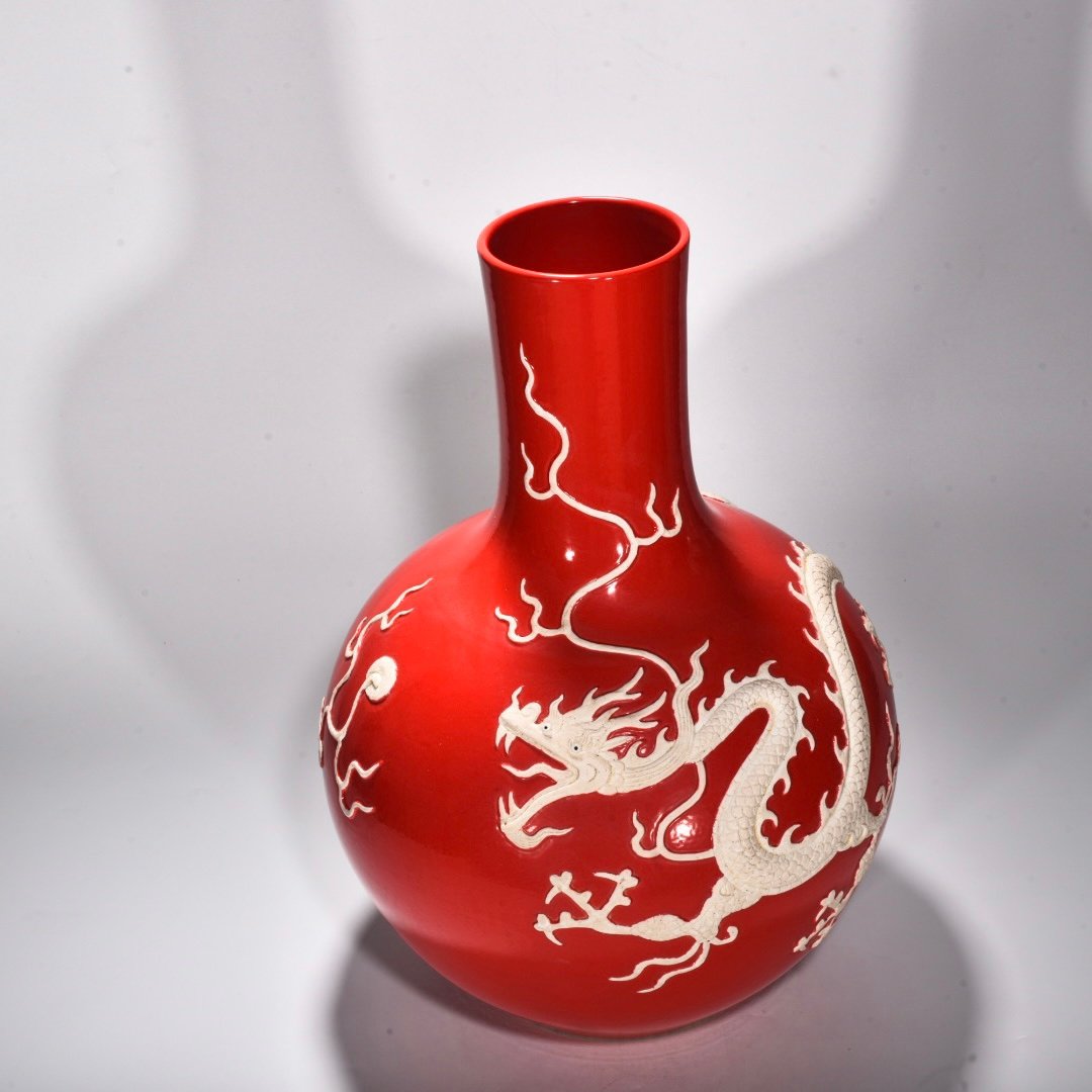 Yuan Dynasty Red glazed celestial sphere vase with cloud and dragon patterns carved