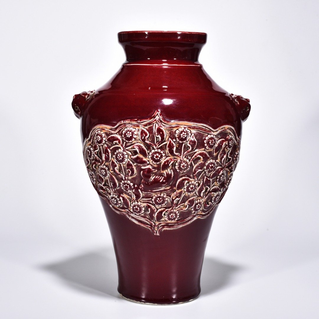 Yuan Dynasty red glaze laminated mandarin duck flower pattern animal ear disc-mouth bottle