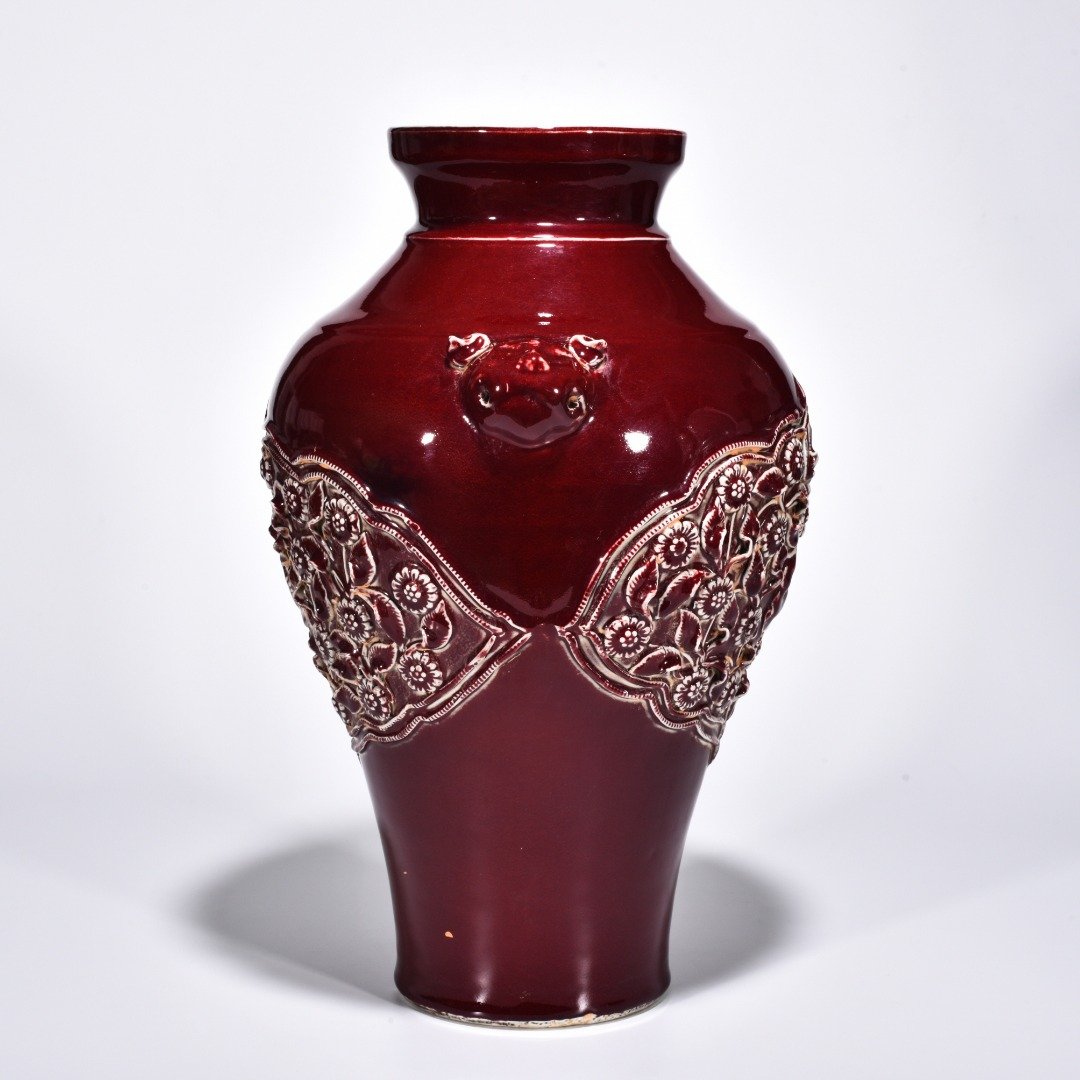 Yuan Dynasty red glaze laminated mandarin duck flower pattern animal ear disc-mouth bottle