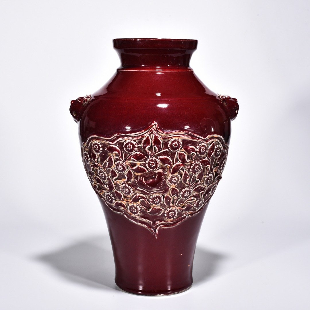 Yuan Dynasty red glaze laminated mandarin duck flower pattern animal ear disc-mouth bottle