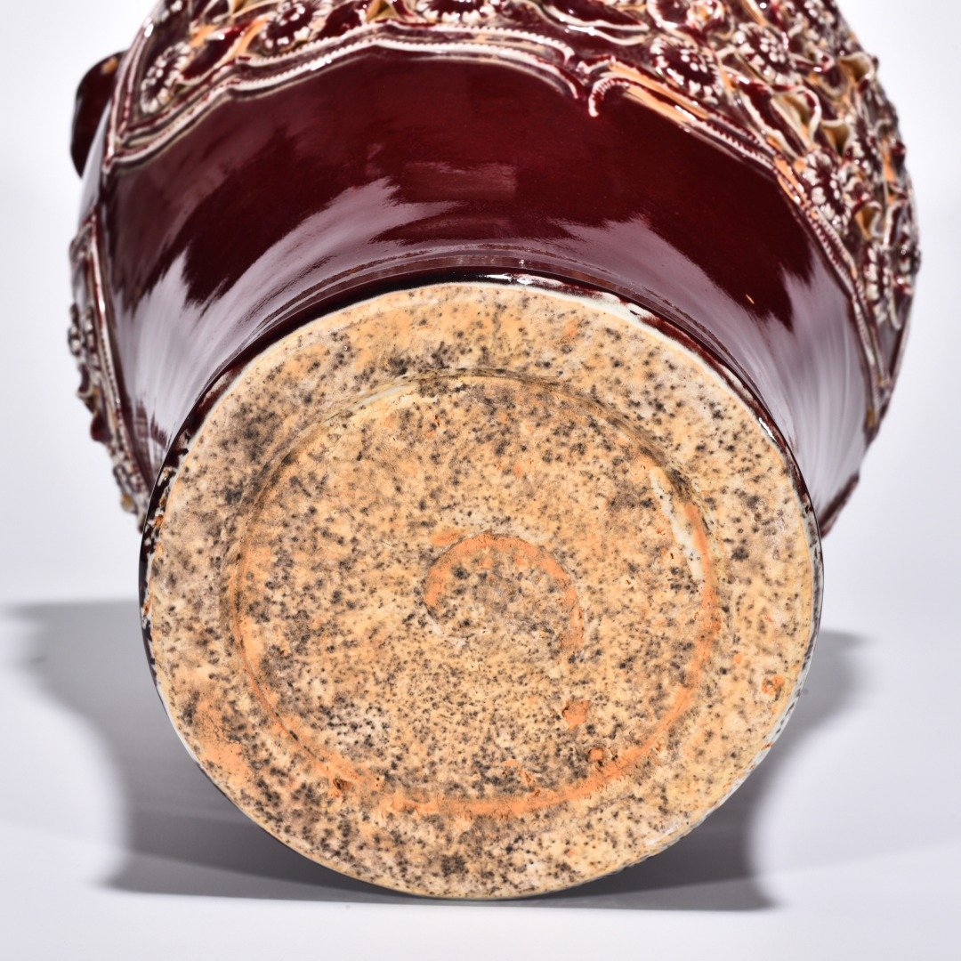 Yuan Dynasty red glaze laminated mandarin duck flower pattern animal ear disc-mouth bottle