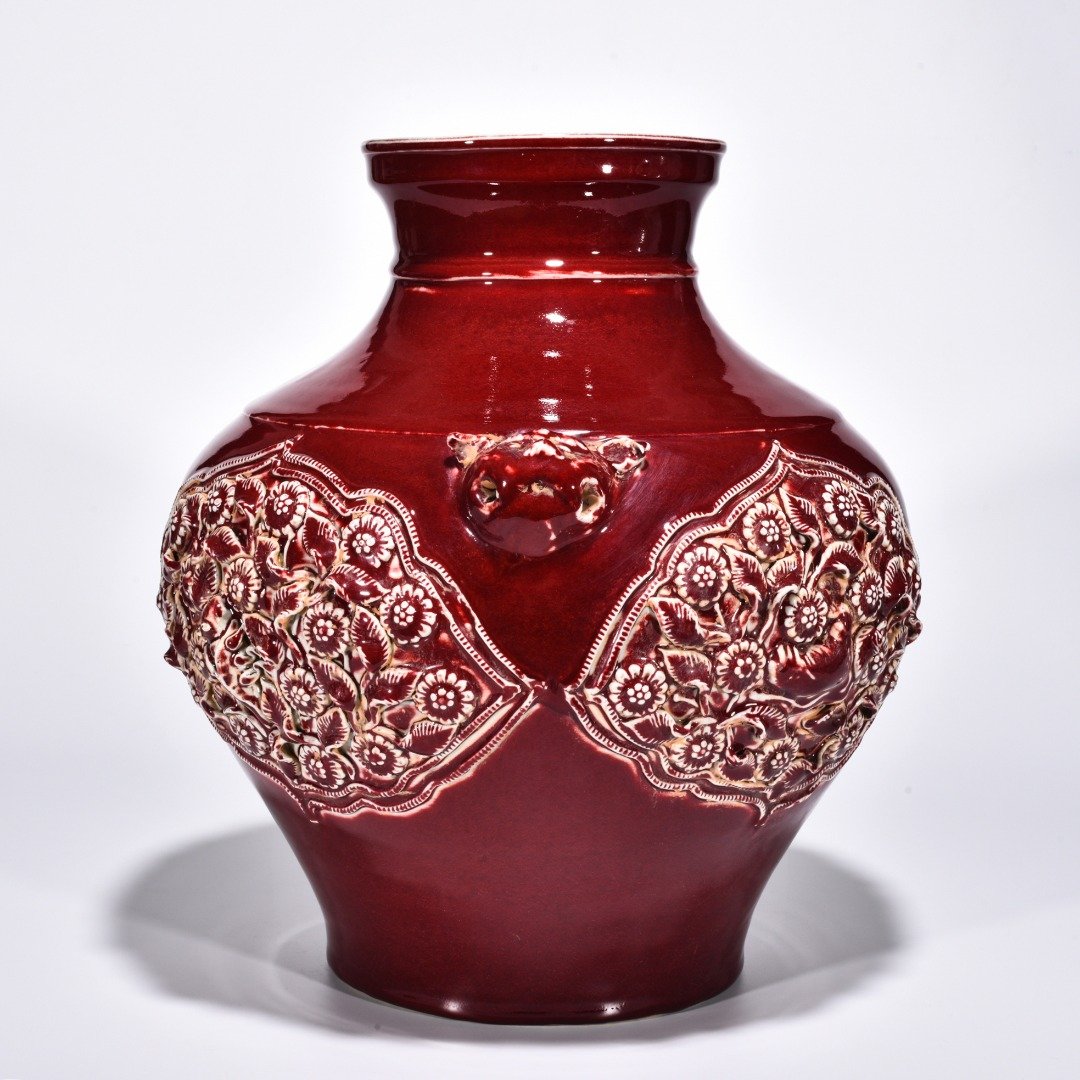 Yuan Dynasty red glazed mandarin duck and flower pattern animal ear jar