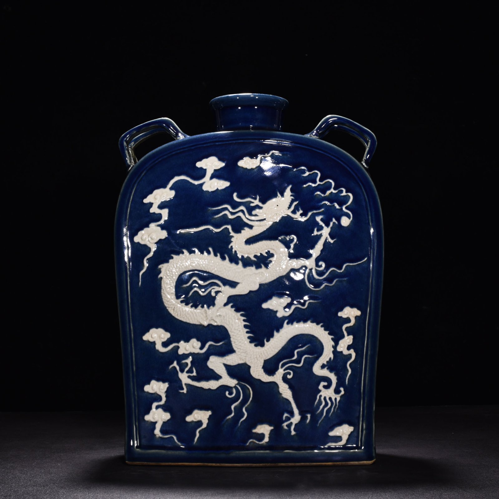 Yuan Dynasty blue glaze engraved with cloud and dragon pattern four series flat bottle