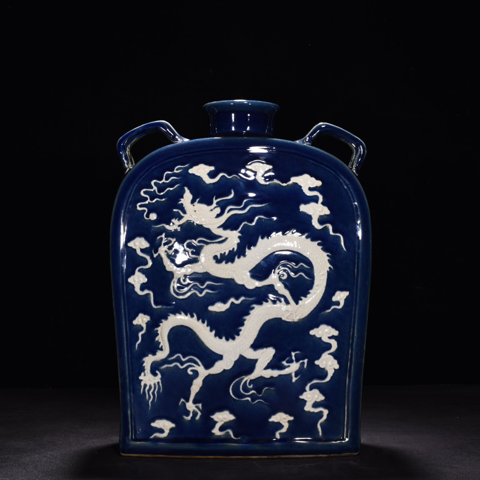Yuan Dynasty blue glaze engraved with cloud and dragon pattern four series flat bottle