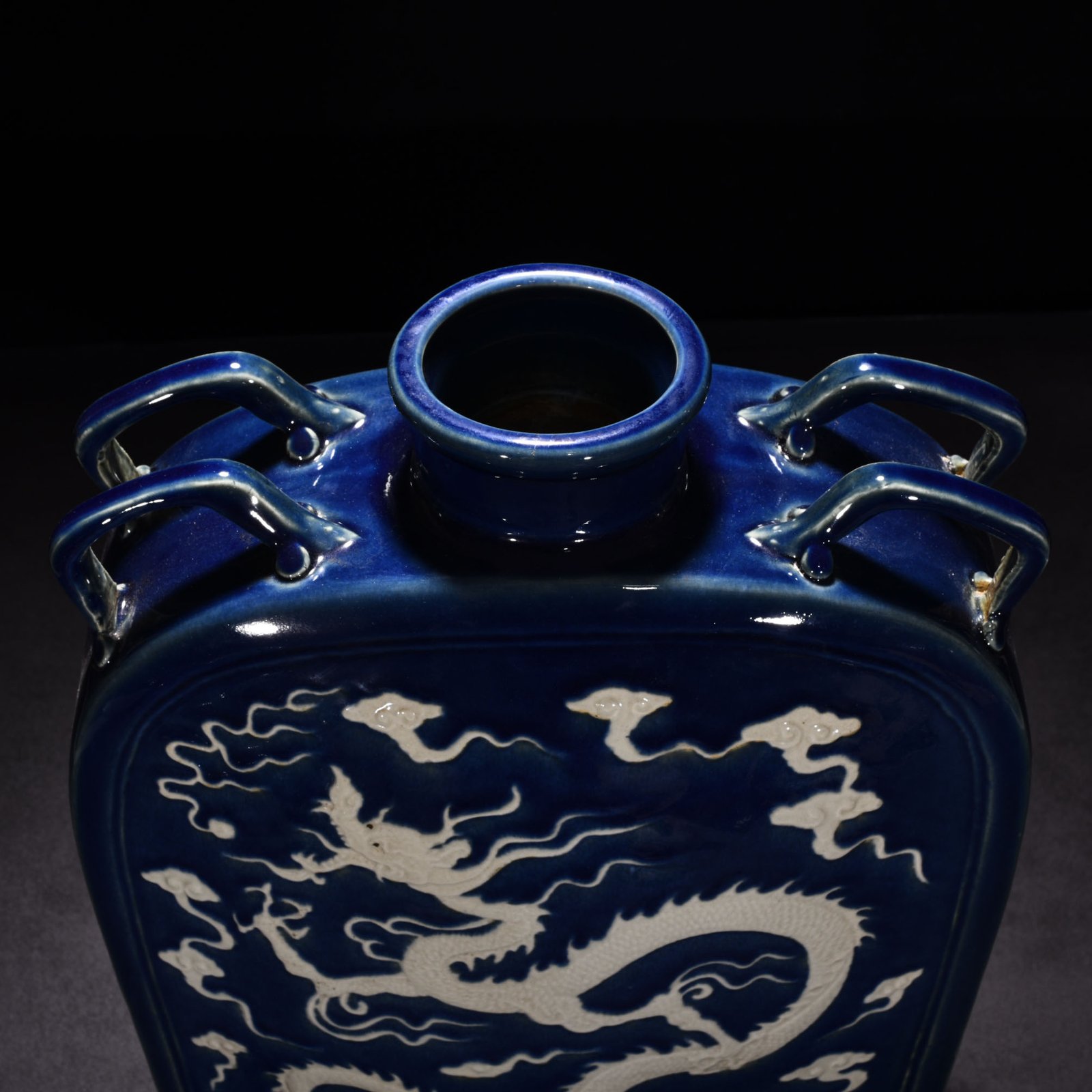Yuan Dynasty blue glaze engraved with cloud and dragon pattern four series flat bottle