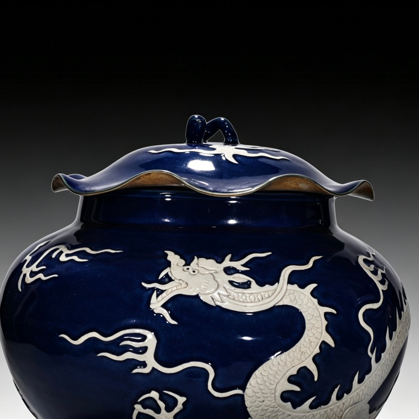 Yuan Dynasty blue-glazed lotus leaf jar with white engraved cloud and dragon pattern