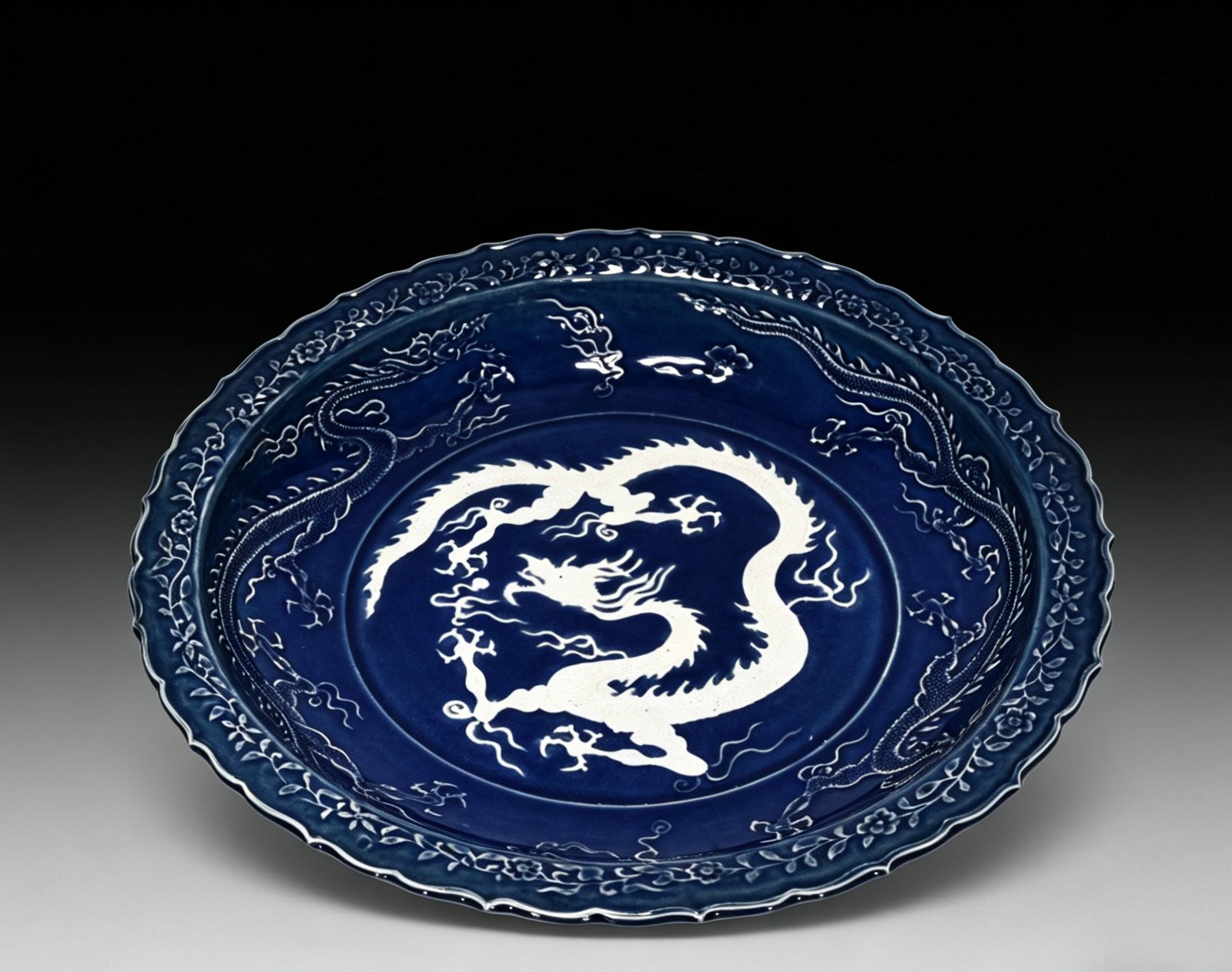Yuan Dynasty blue glaze blank engraved cloud and dragon pattern rhombus edge folding plate