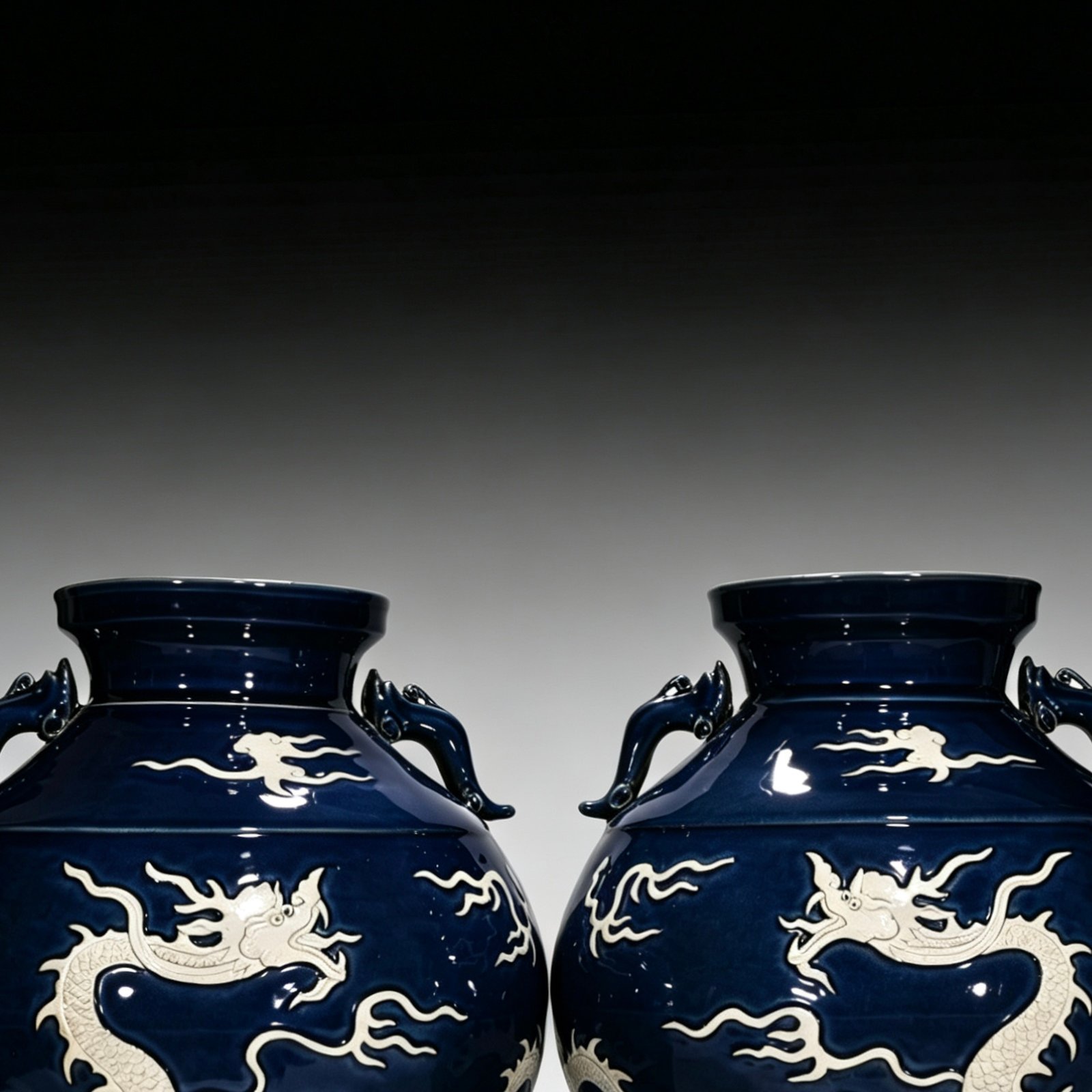 Yuan Dynasty blue glaze with white space and engraved cloud and dragon pattern on the ear jar