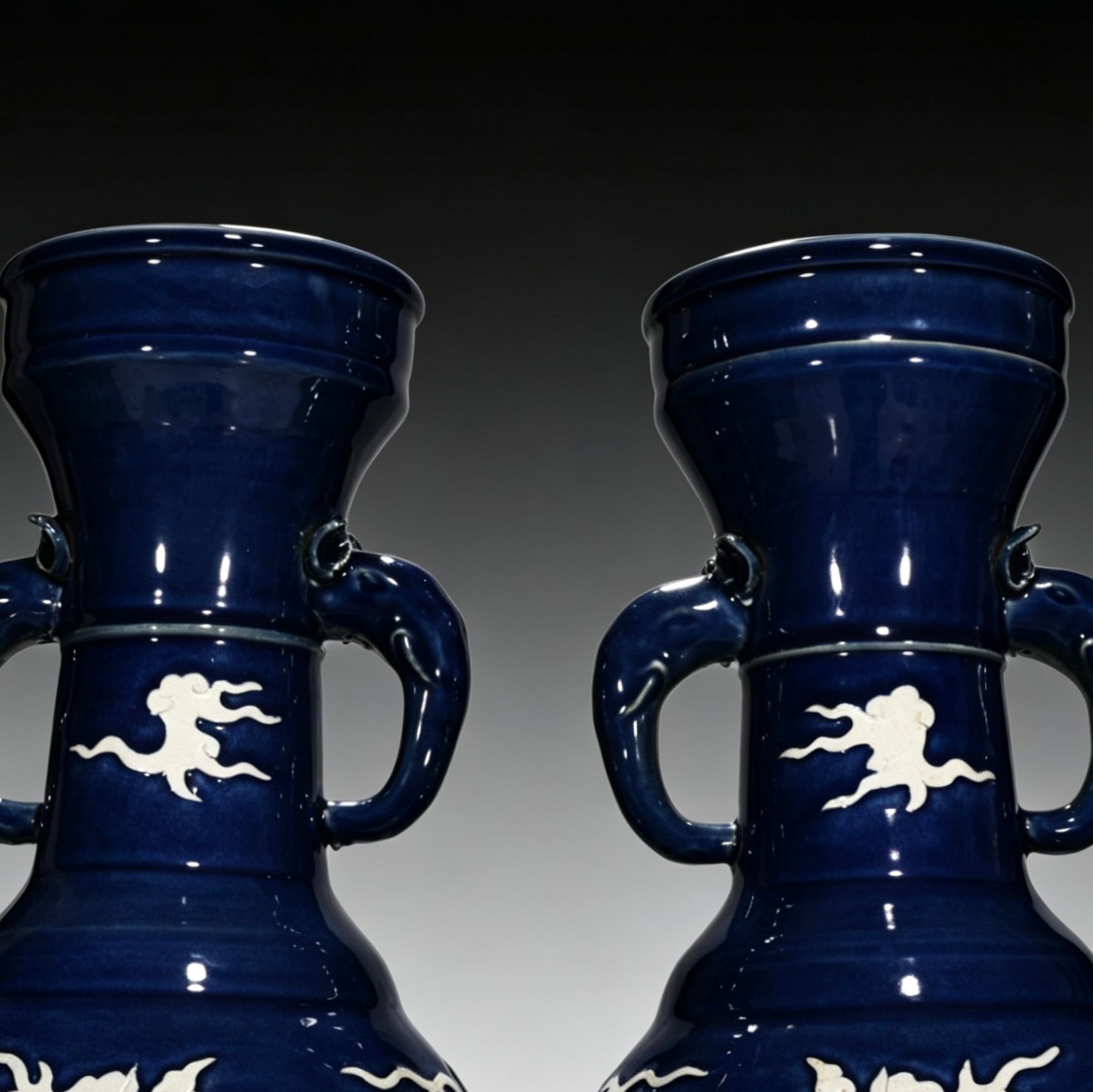 Yuan Dynasty blue glaze white elephant ear vase engraved with cloud and dragon pattern