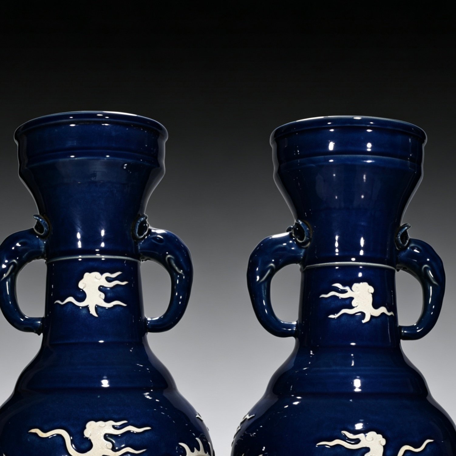 Yuan Dynasty blue glaze white elephant ear vase engraved with cloud and dragon pattern