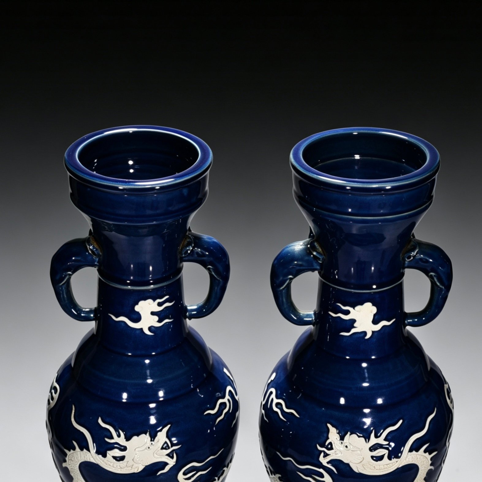 Yuan Dynasty blue glaze white elephant ear vase engraved with cloud and dragon pattern