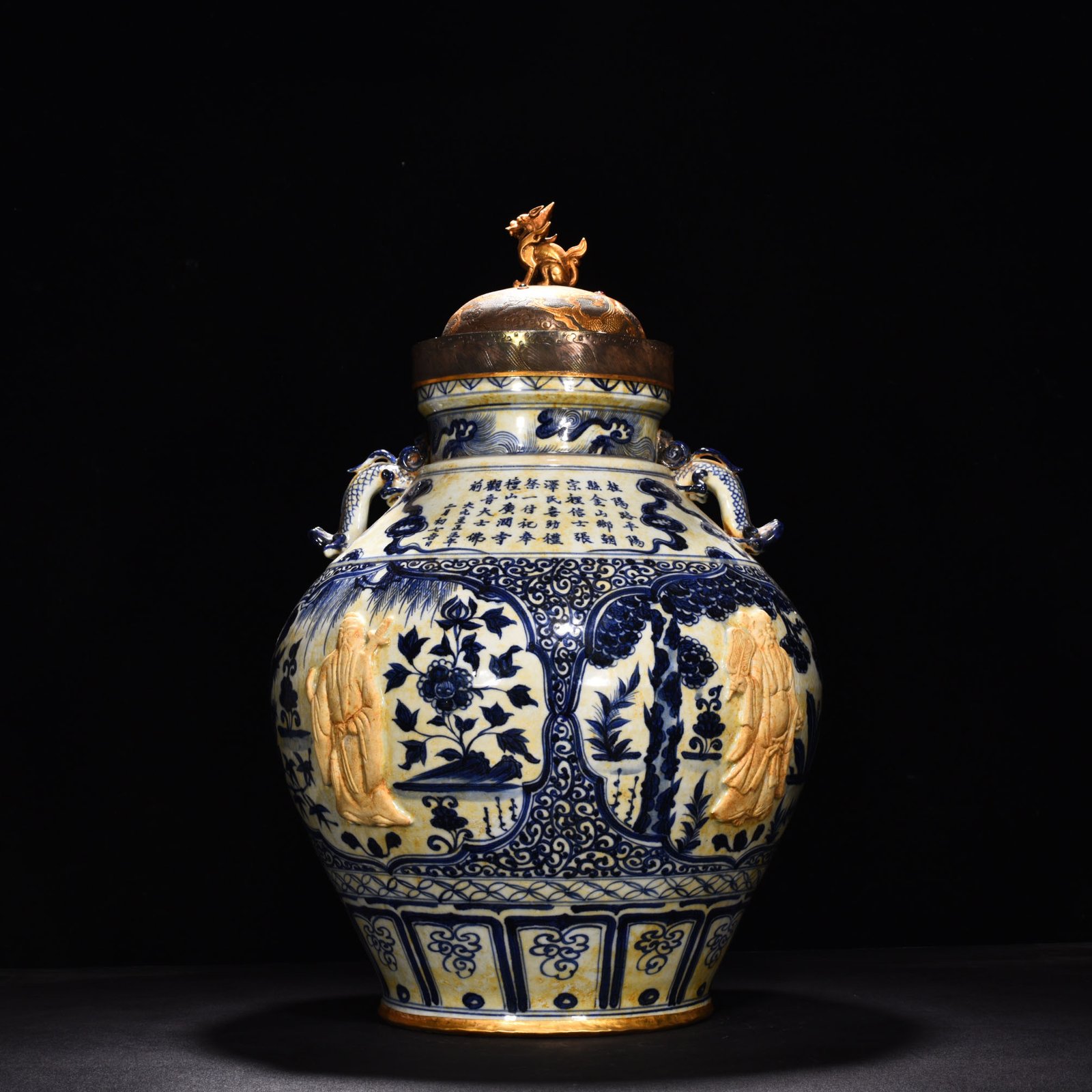 Yuan Dynasty blue and white carved Eight Immortals pattern with ear lid jar