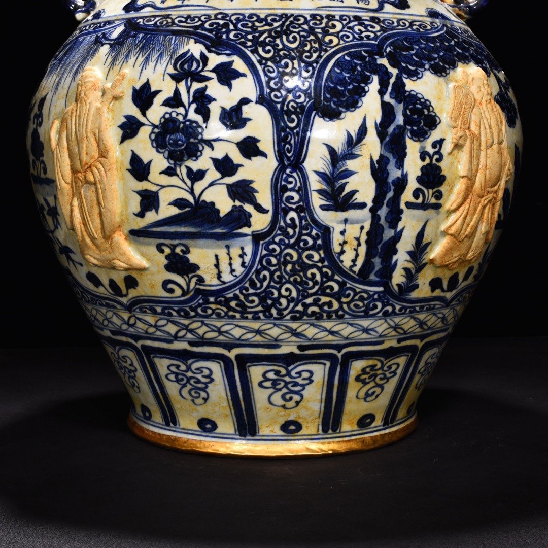 Yuan Dynasty blue and white carved Eight Immortals pattern with ear lid jar