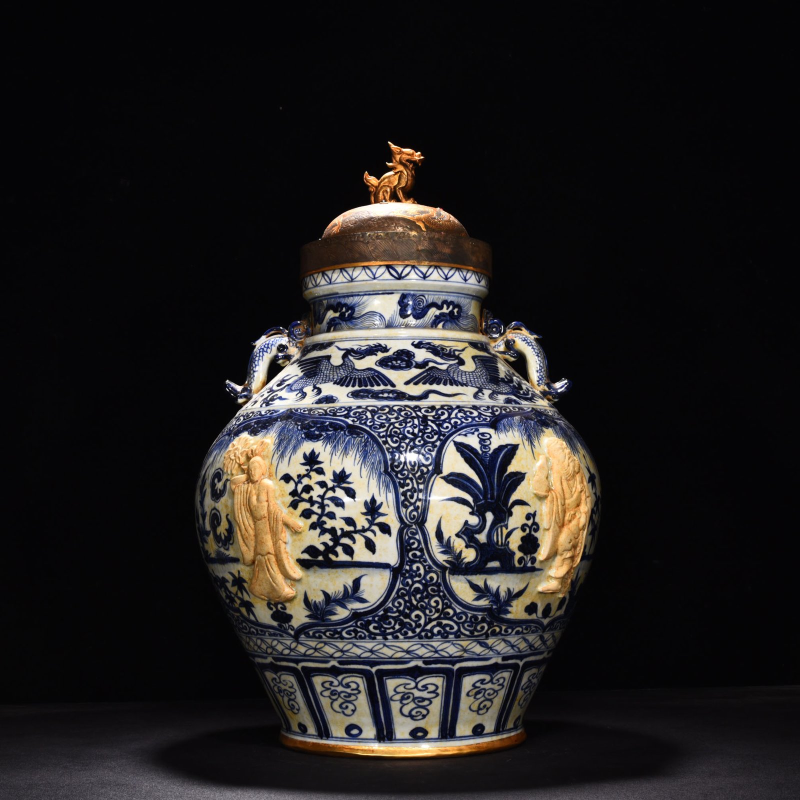 Yuan Dynasty blue and white carved Eight Immortals pattern with ear lid jar