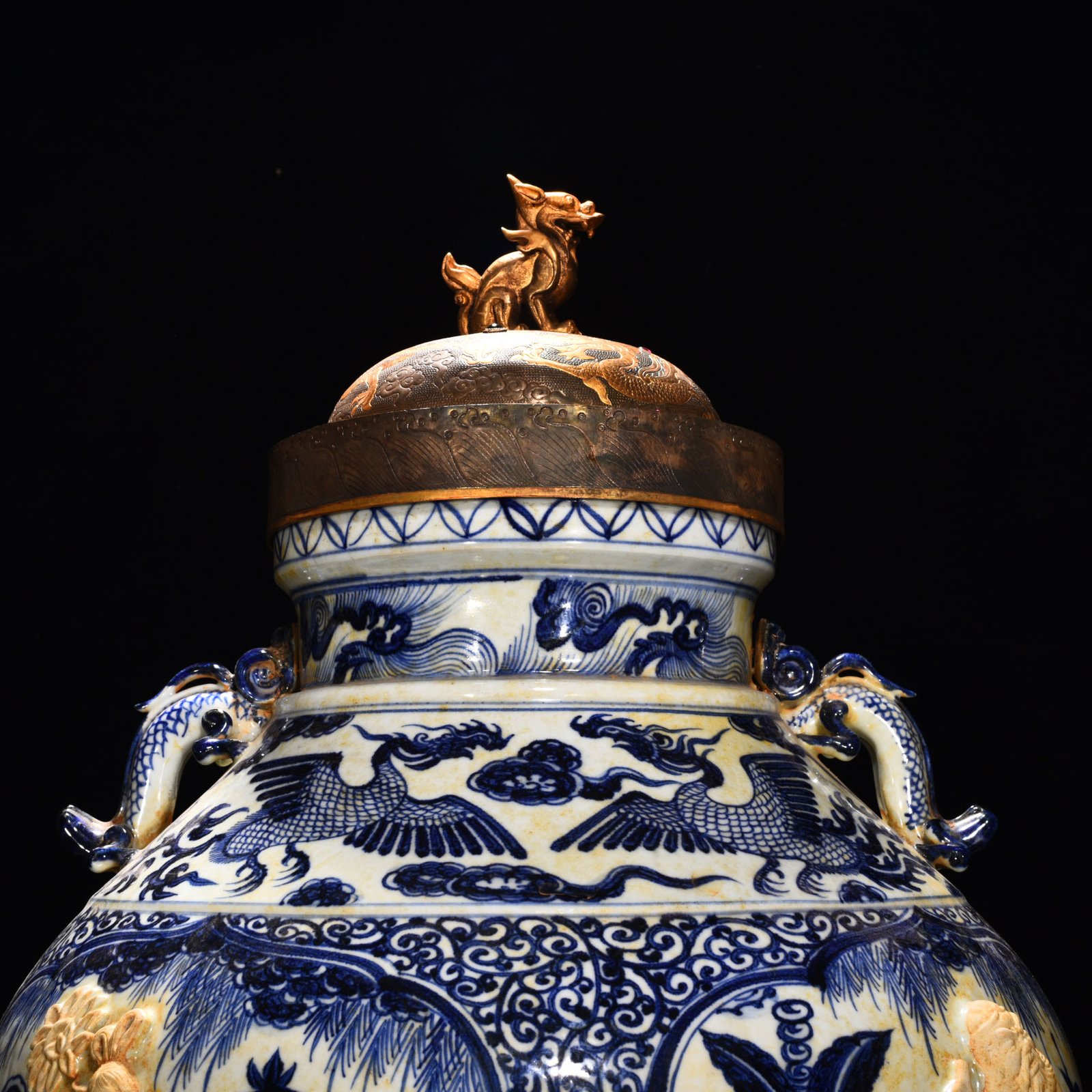 Yuan Dynasty blue and white carved Eight Immortals pattern with ear lid jar