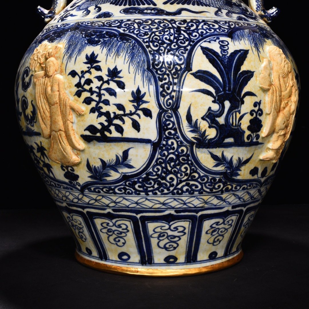 Yuan Dynasty blue and white carved Eight Immortals pattern with ear lid jar